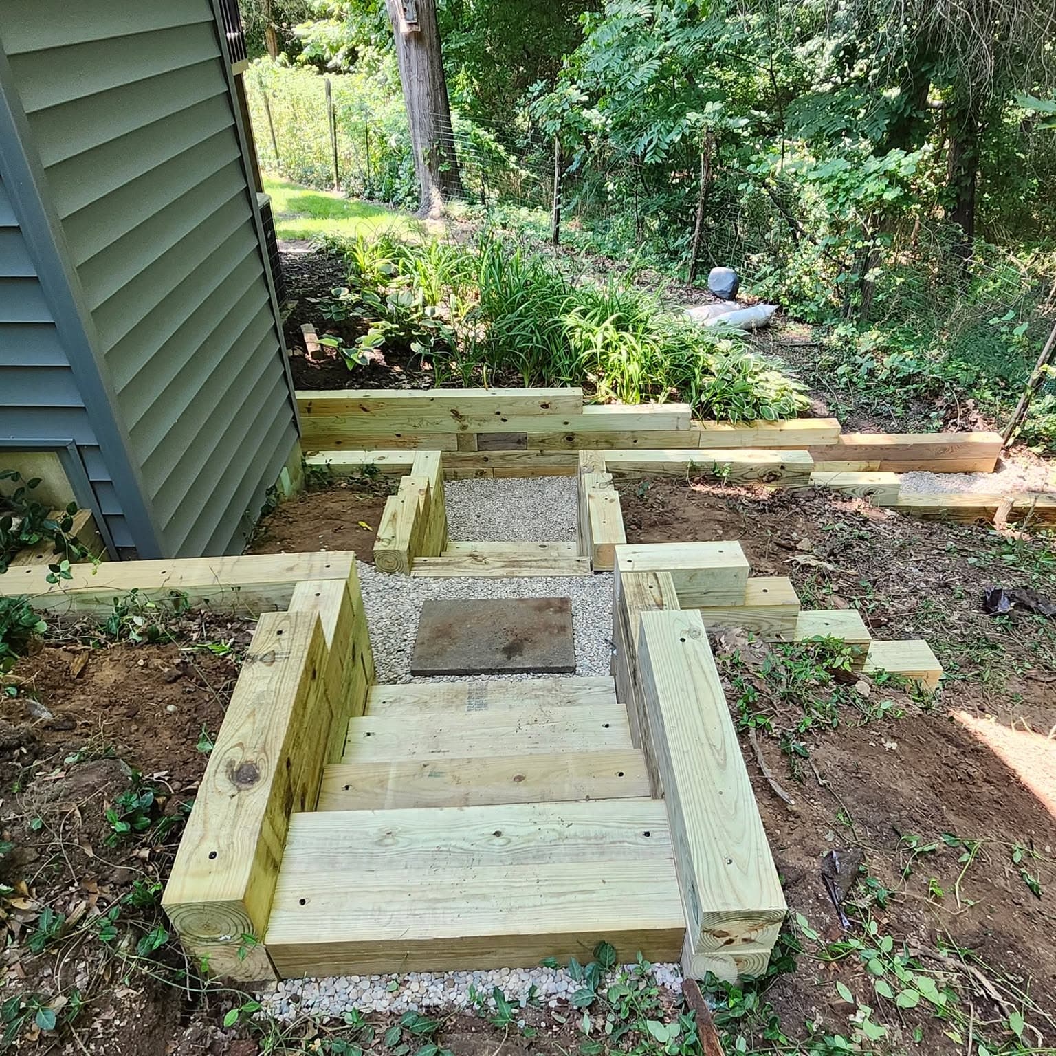Timber retaining walls and stone steps built by Fresh Cuts
