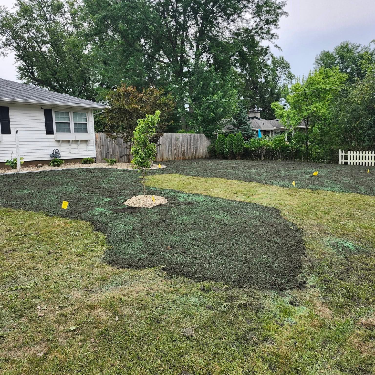 Topsoil and grass-seed installation on a Grand Rapids lawn